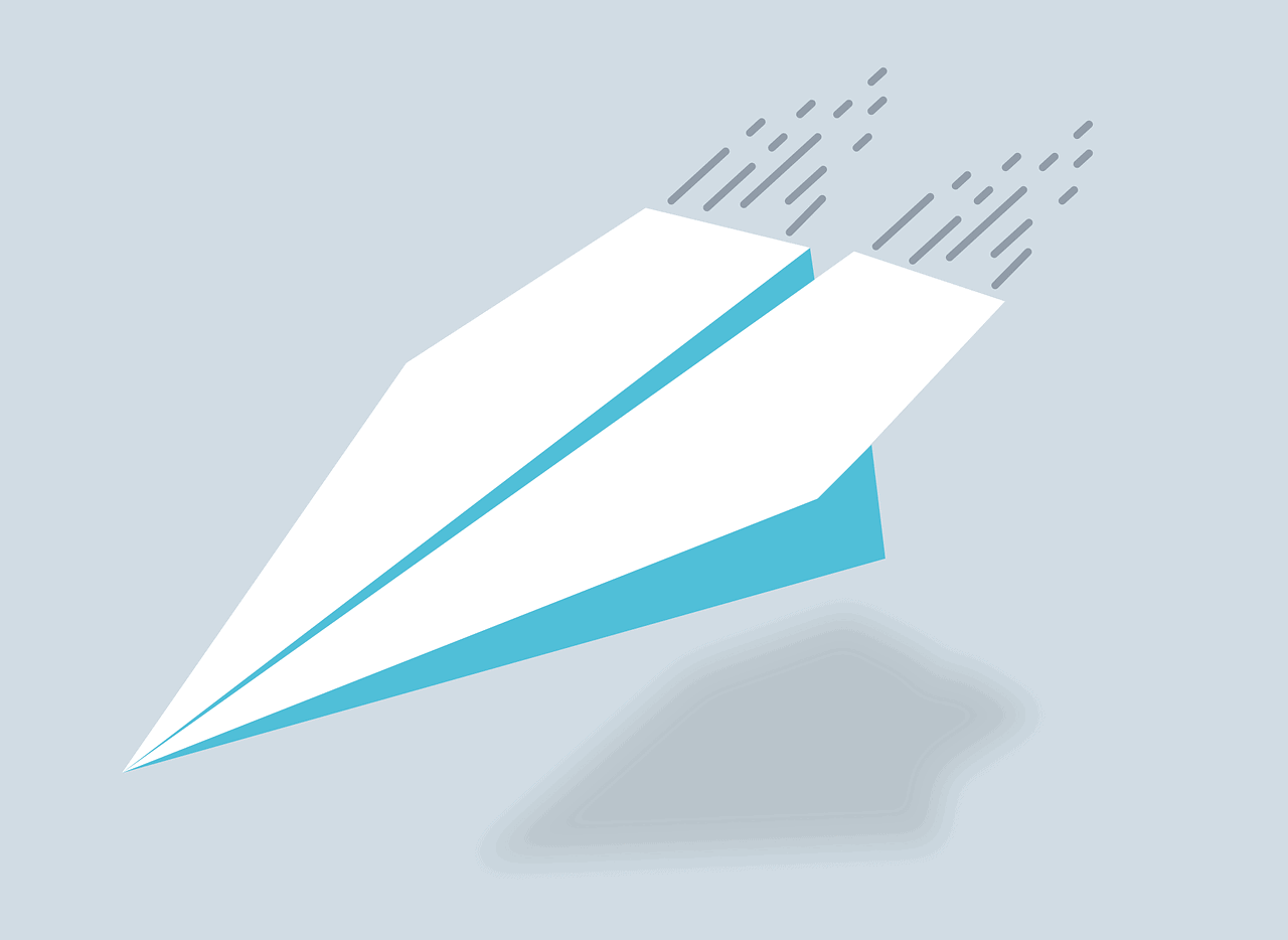 Illustration av ett pappersflygplan med fartränder efter sig